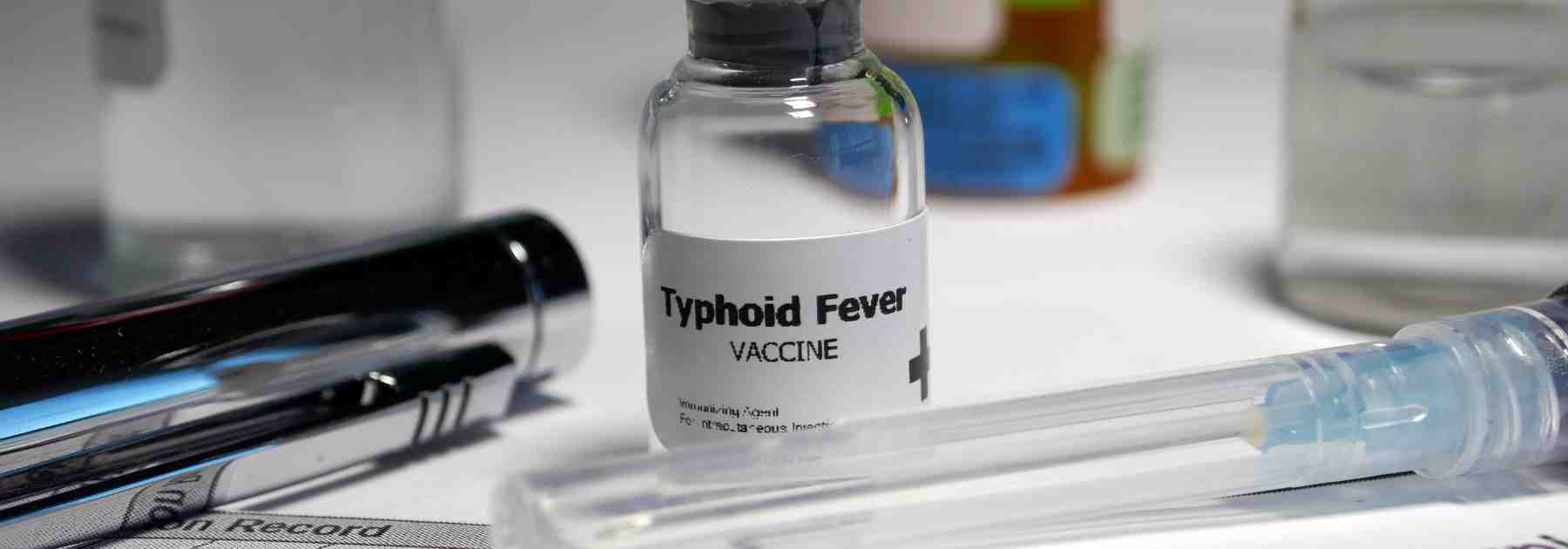 How long does the typhoid vaccine last for long-term travellers? 